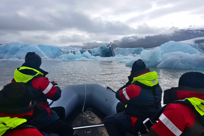 Passangers on a boat tour on a glacier lagoon.