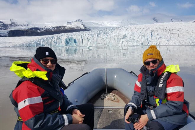 Passangers on a boat tour on a glacier lagoon.