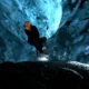 A person in an ice cave in Iceland.