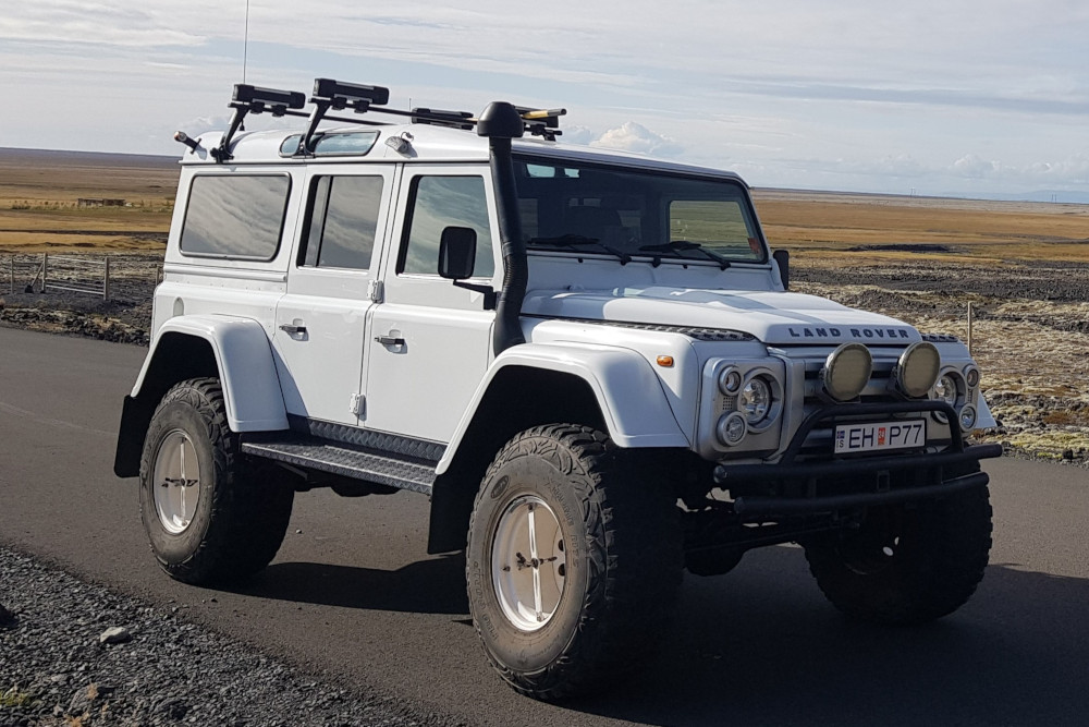 White Land Rover Defender.