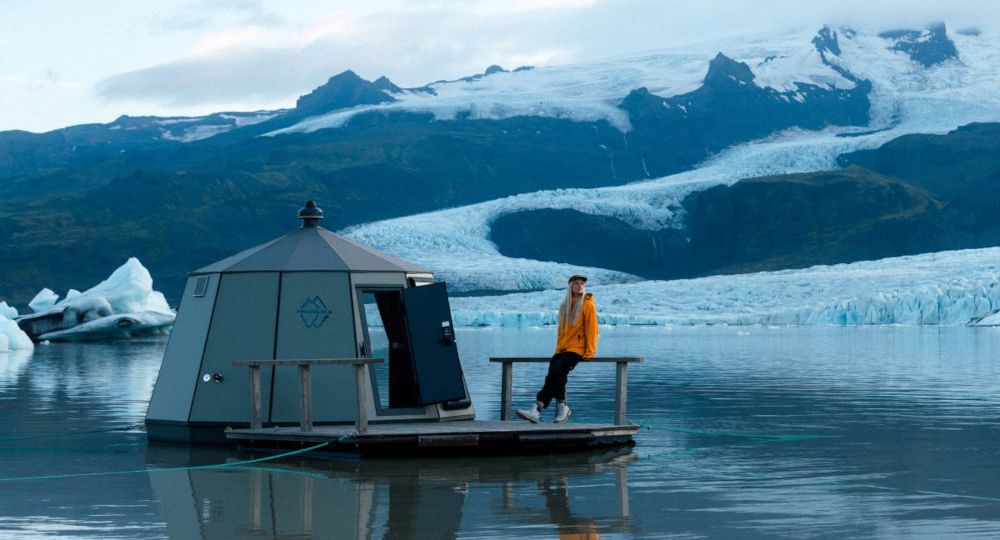 A floating igloo hut with a person.