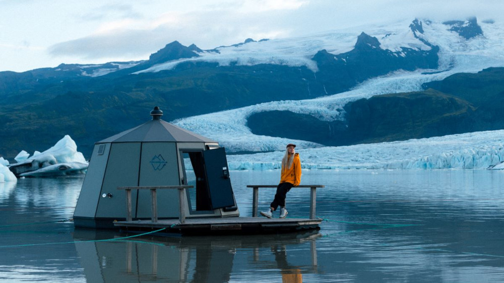 A floating igloo hut with a person.