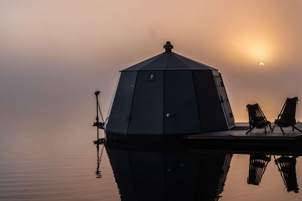Floating igloo hut in a twilight sun.