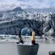 Champagne against the backdrop of mountains and a glacier.