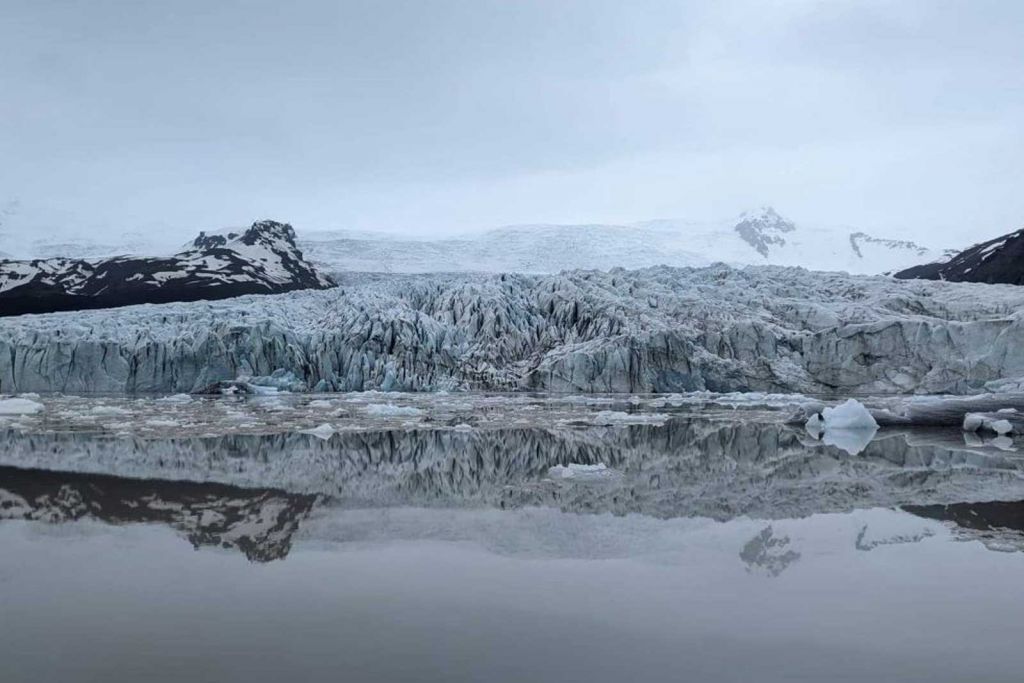 Beautiful views, glacier reflecting in the mirror-like water.