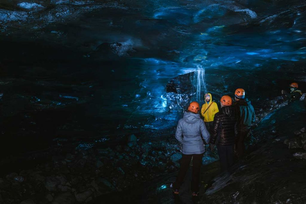 Tourists in an ice cave in Iceland.