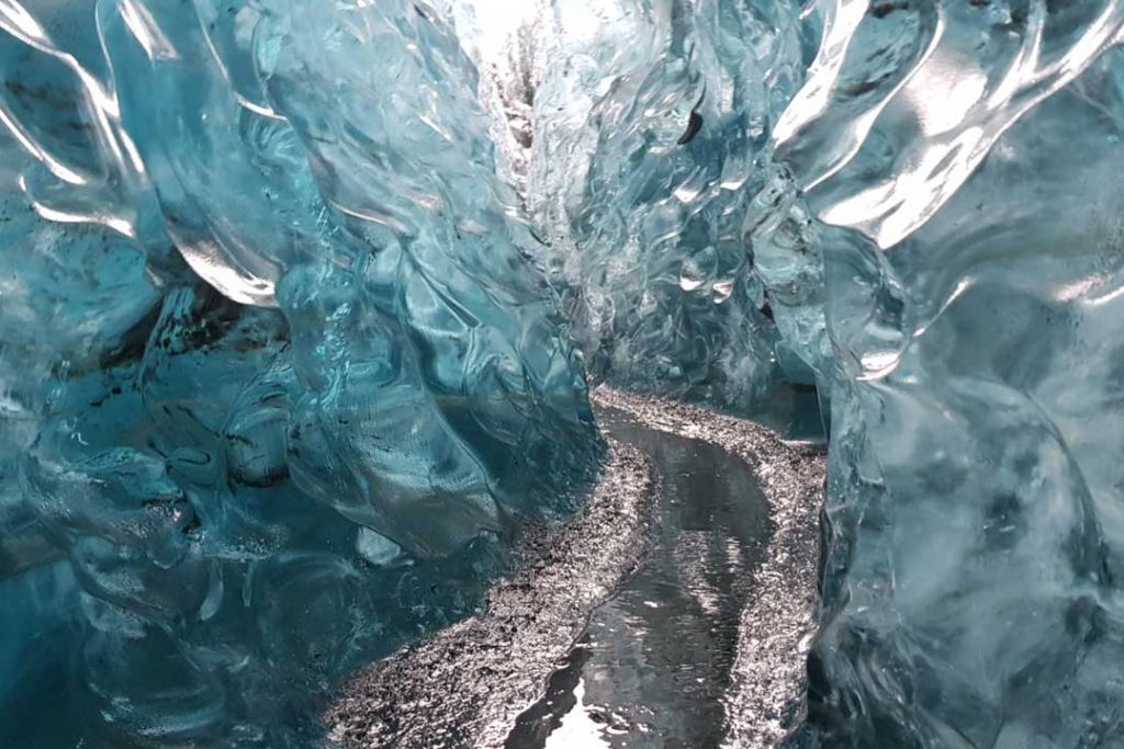 Ice crevice with a stream of water.