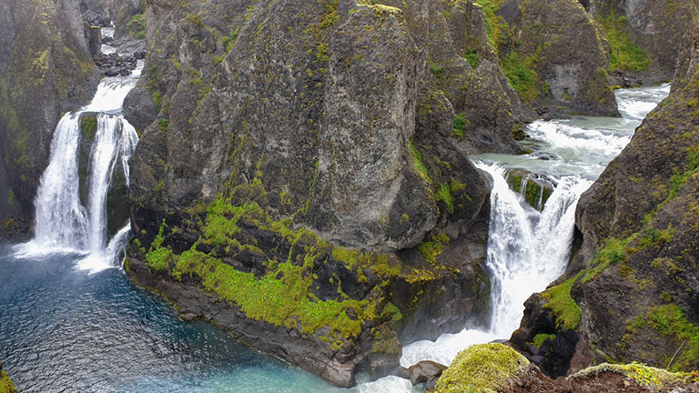 Núpsárfoss-and-Hvítárfoss Núpsárfoss and Hvítárfoss plunge into Tvílitahylur where the different coloured rivers meet.